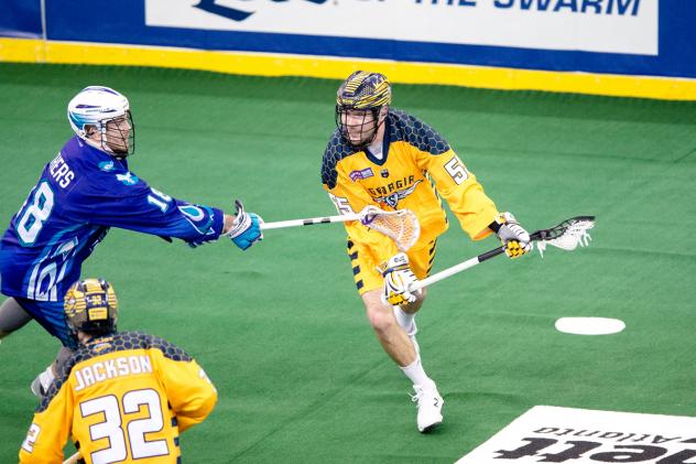 Bryan Cole of the Georgia Swarm test the Rochester Knighthawks' defense