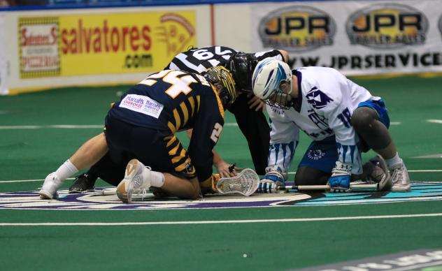 Joel Coyle of the Georgia Swarm faces off with Jake Withers of the Rochester Knighthawks