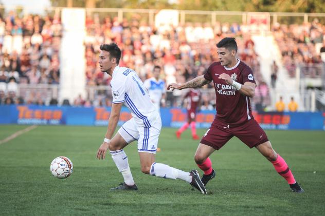 Sacramento Republic FC vies with Reno 1868 FC for possession