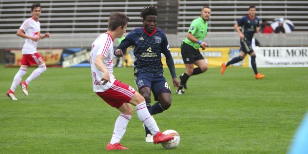 Michee Ngalina of Bethlehem Steel FC battles for possession against New York Red Bulls II