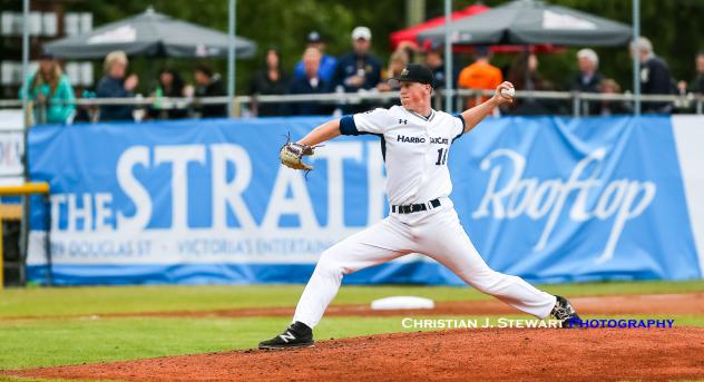 Victoria HarbourCats pitcher Ethan Fox delivers a pitch against Wenatchee on Friday