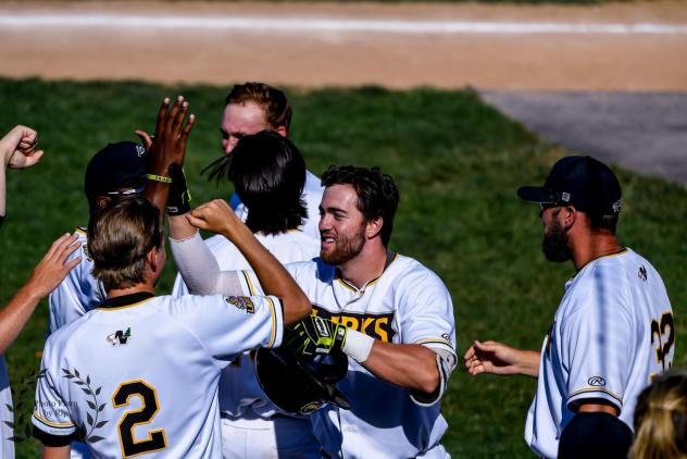 Ryan Anderson receives congratulations from Bismarck Larks teammates