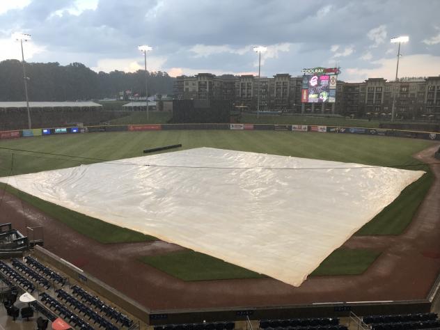 The tarp covers the field at Coolray Field, home of the Gwinnett Stripers