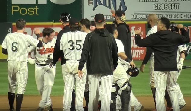 Long Island Ducks congratulate Travis Snider on his game-winning hit