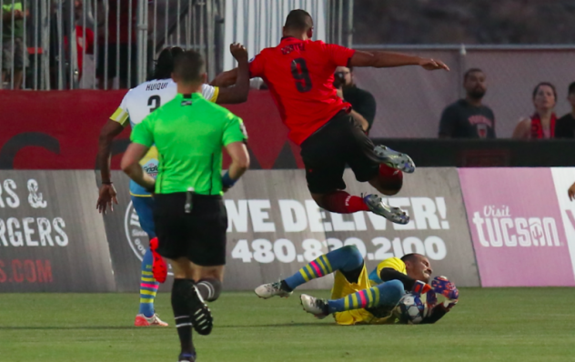 Las Vegas Lights FC goalkeeper Ricardo Ferrino makes a sliding stop at Phoenix Rising FC