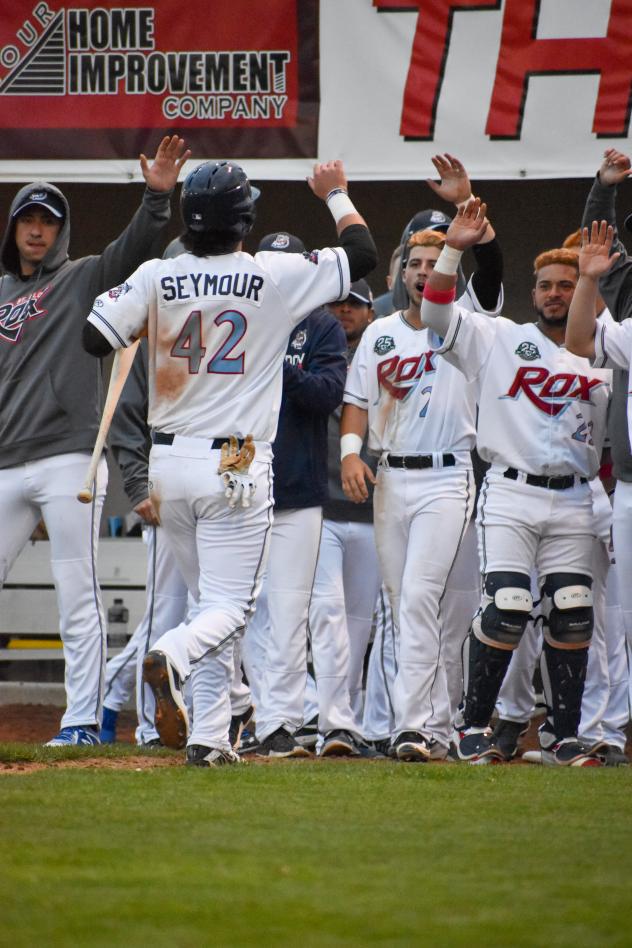 St. Cloud Rox congratulate Bobby Seymour on his home run