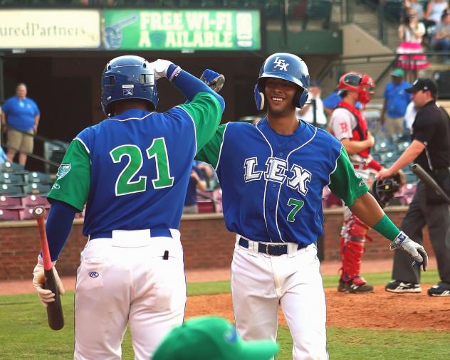 Dennicher Carrasco (21) and MJ Melendez of the Lexington Legends