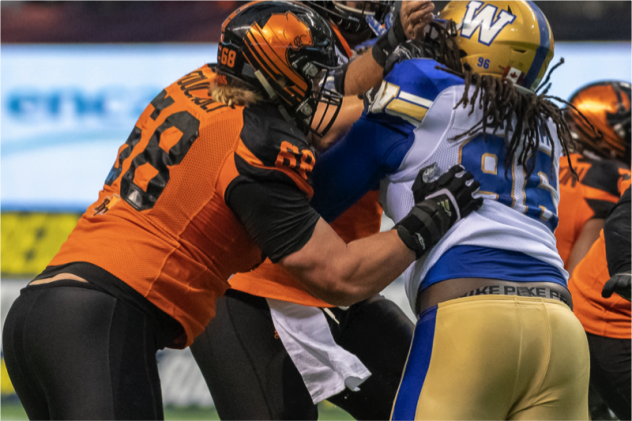 David Foucault of the B.C. Lions protects against the Winnipeg Blue Bombers rush