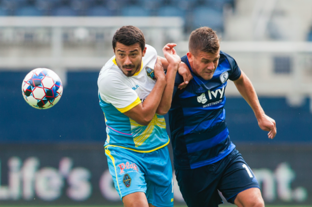 Las Vegas Lights FC's Juan Herrera-Perla (left) works for possession vs. the Swope Park Rangers