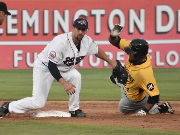 Craig Massey of the Somerset Patriots applies the tag