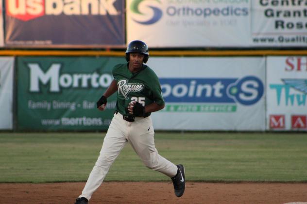 Josh McIntyre of the Medford Rogues rounds the bases following a homer