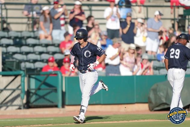 Charleston RiverDogs first baseman Chris Hess trots around the bases
