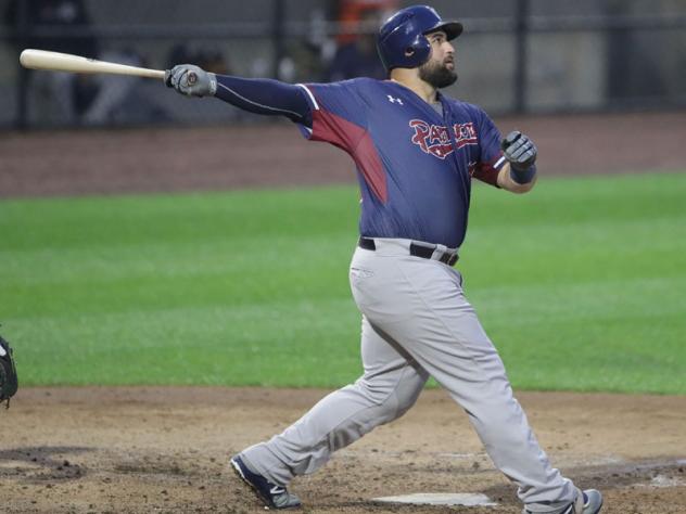 Kyle Roller of the Somerset Patriots follows through on his swing