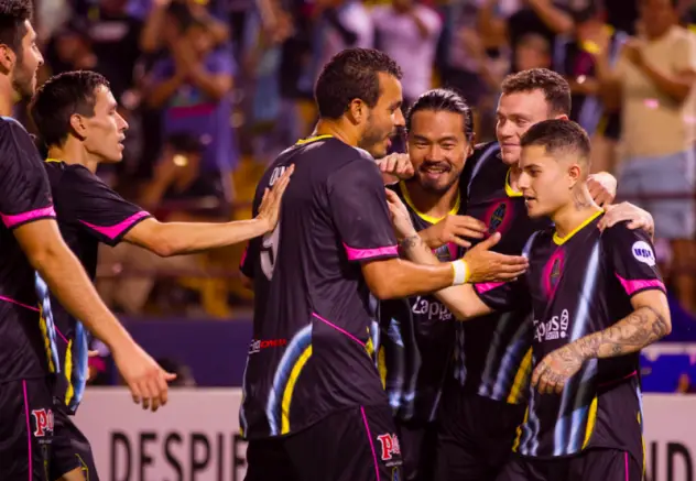 Las Vegas Lights FC players celebrate a second half goal by Raul Mendiola (far right)