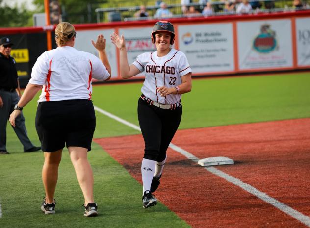 Gwen Svekis of the Chicago Bandits receives a high five while rounding the bases