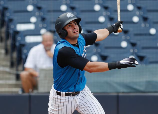 Angel Aguilar of the Tampa Tarpons watches the ball sail