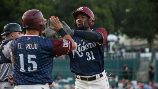 Destin Hood of the Frisco RoughRiders receives high fives