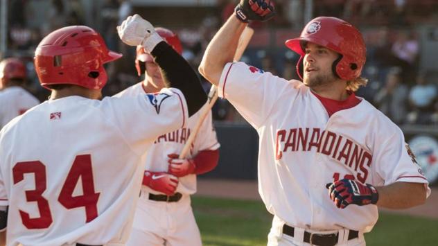 Vancouver Canadians congratulate SS Vinny Capra on his home run