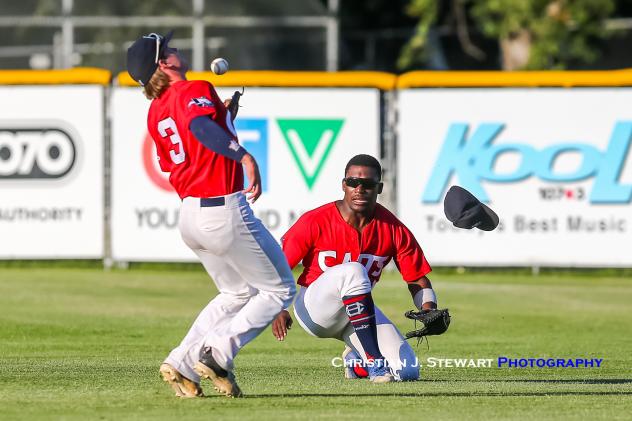 With outfielder AJ Lewis losing his cap, Victoria HarbourCats second baseman Rowdy Jordan makes a great catch