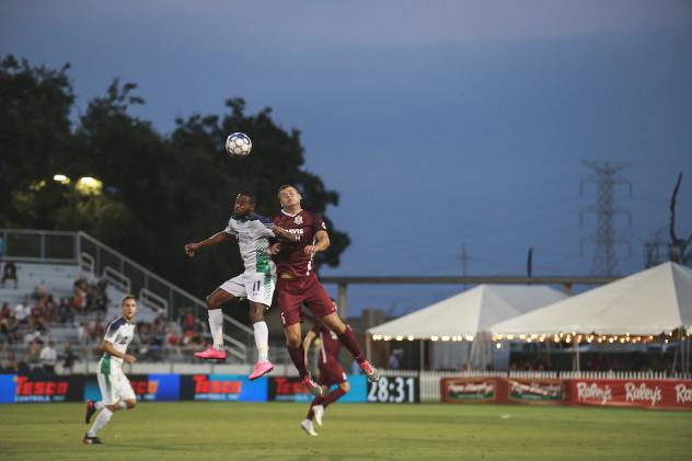 Sacramento Republic FC defender Justin Schmidt goes high for the ball vs. OKC Energy FC