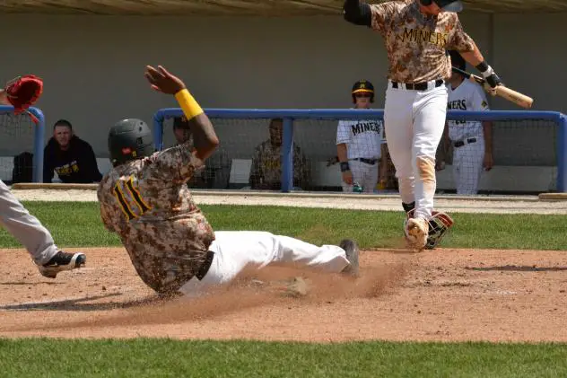Sussex County Miners infielder Daniel Mateo slides home safely