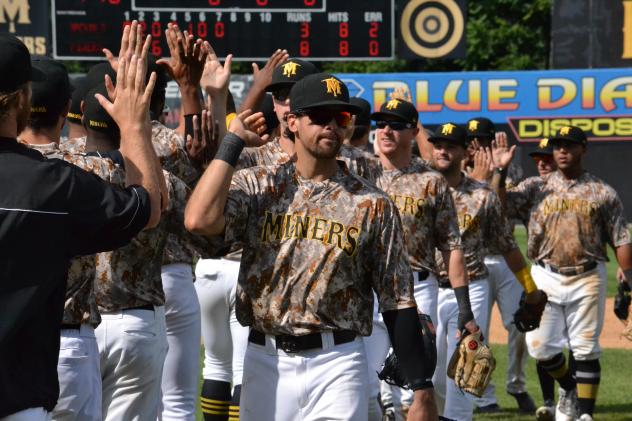 Sussex County Miners congratulate each other on a win