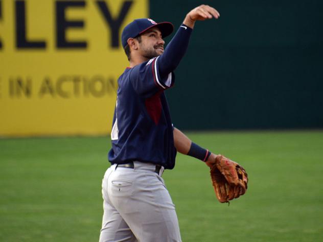 Alfredo Rodriguez of the Somerset Patriots tosses a ball into the crowd