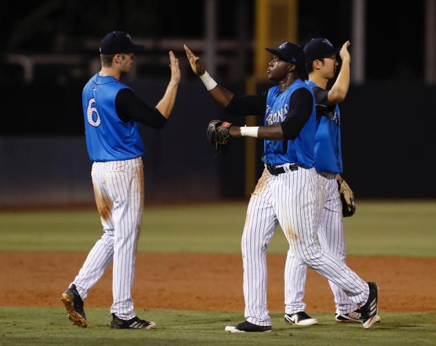 Ben Ruta and Estevan Florial of the Tampa Tarpons exchange high fives