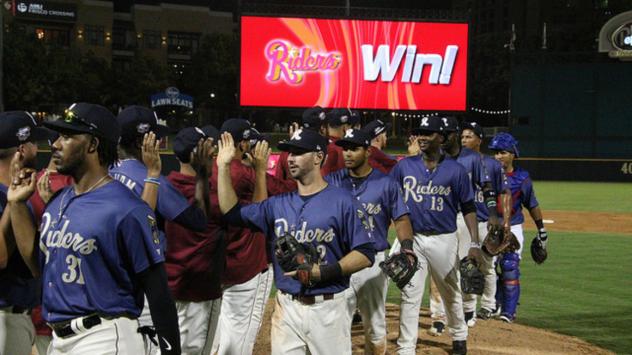 Frisco RoughRiders exchange congratulations after a win