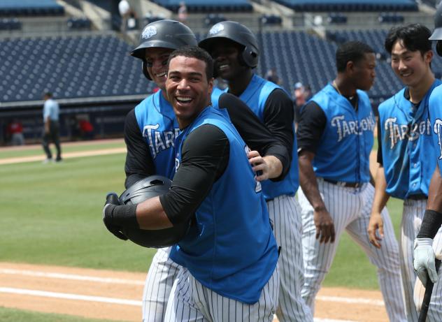 Dom Thompson-Williams is congratulated by Tampa Tarpons teammates