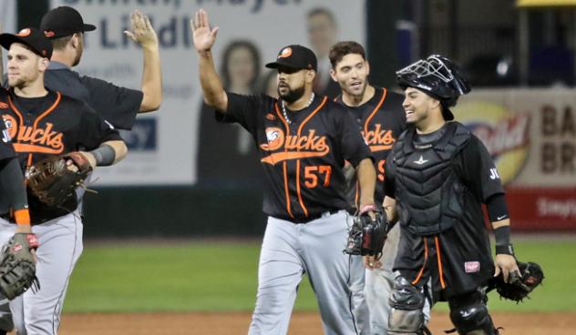 Long Island Ducks exchange high fives following a win