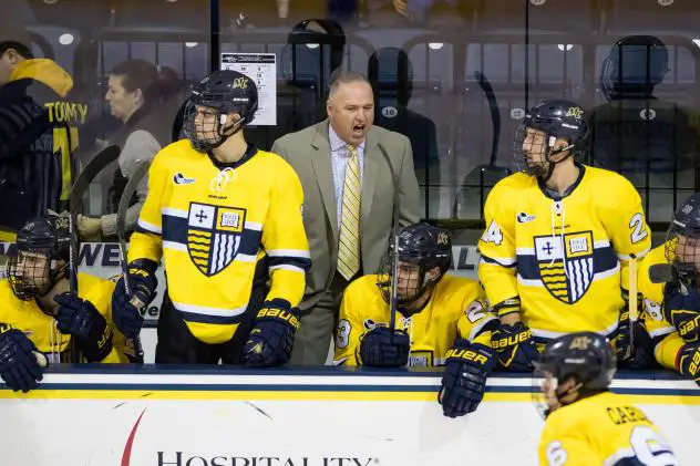 Mark Dennehy shouts instructions while with Merrimack College