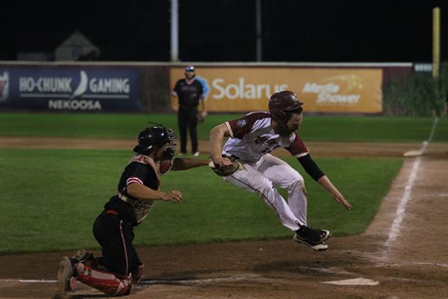 Wisconsin Rapids Rafters and the Battle Creek Bombers in a play at the plate