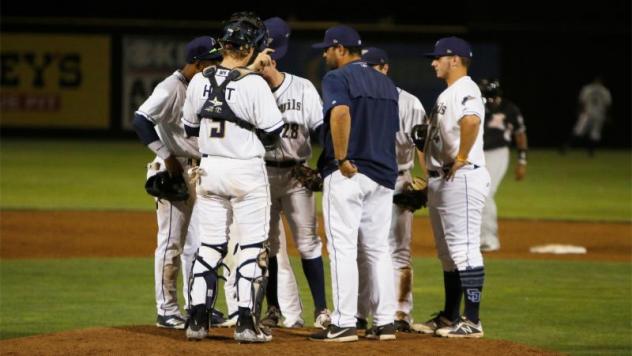 Tri-City Dust Devils huddle on the mound