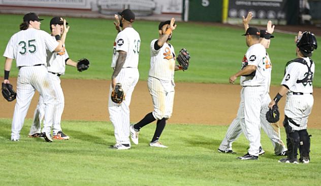 Long Island Ducks exchange high fives after a late win