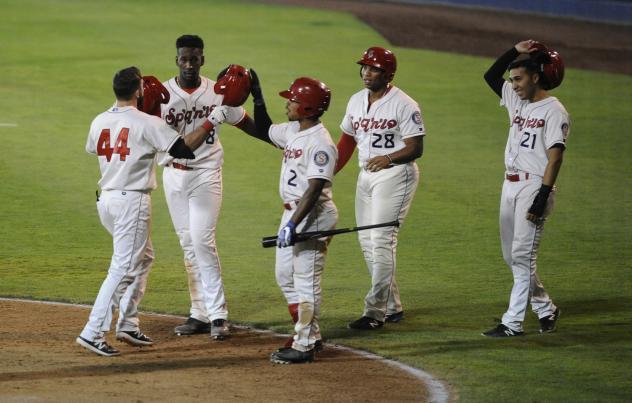 Spokane Indians exchange congratulations during a big night for their bats