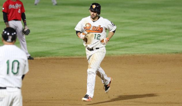 Dan Lyons of the Long Island Ducks rounds the bases following his home run