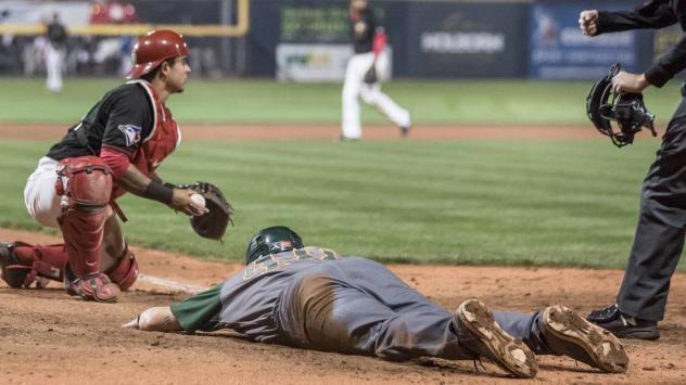 Vancouver Canadians catcher Chris Bec after tagging out Boise Hawks catcher Willie Maciver