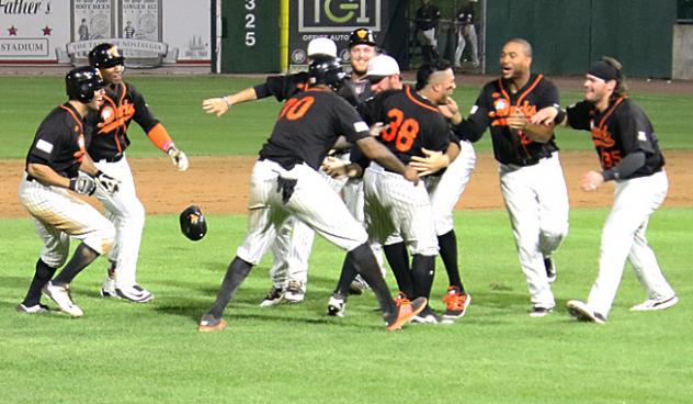 Long Island Ducks mob Ramon Cabrera after his walk-off double