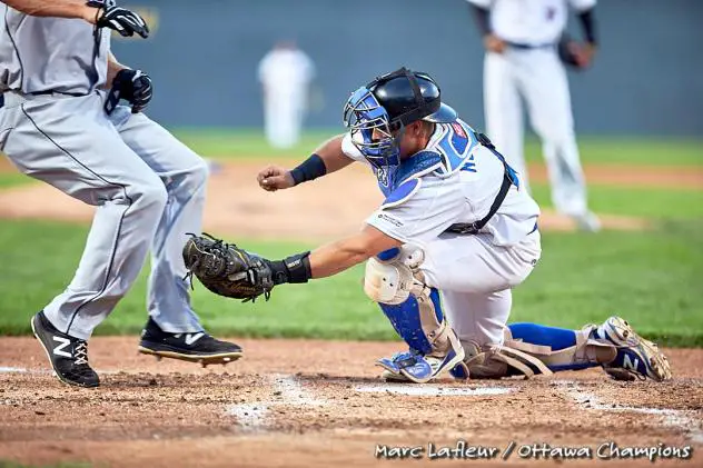 A close play at the plate between the Ottawa Champions and Quebec Capitales