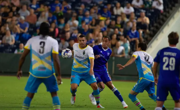 Las Vegas Lights FC's Sammy Ochoa (center) collects possession against Reno 1868 FC