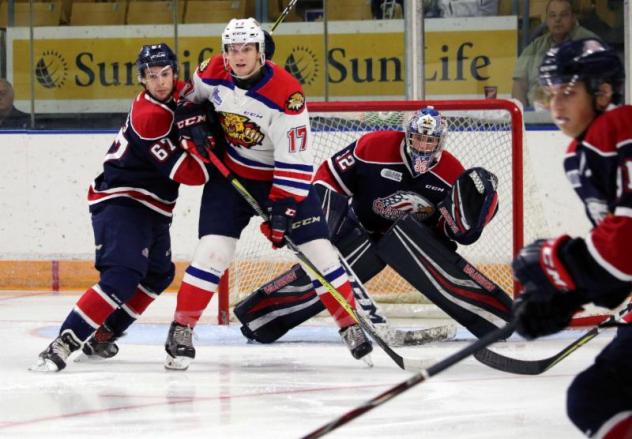 Saginaw Spirit in a preseason battle with the Moncton Wildcats