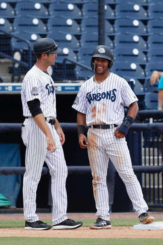 Patrick Osborn (left) and Dom Thompson-Williams of the Tampa Tarpons share a laugh