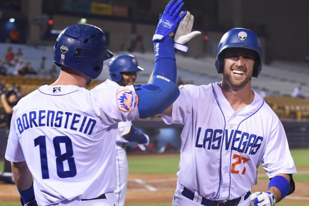 Las Vegas 51s IF/OF Patrick Kivlehan receives a high five