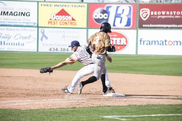 Lynchburg Hillcats first baseman Anthony Miller stretches for the out