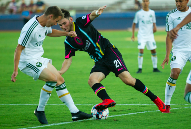 Las Vegas Lights FC's Matt Thomas (21) fights for possession against Portland Timbers 2