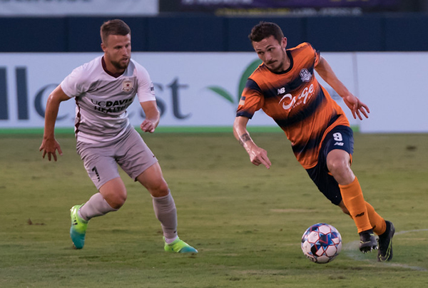 Michael Gamble of the Tulsa Roughnecks (right) vs. Sacramento Republic FC