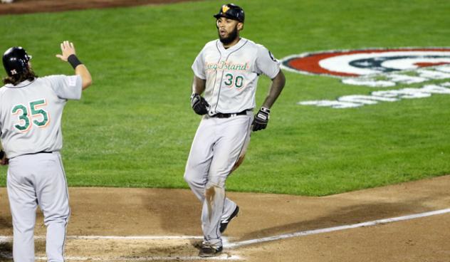 David Washington of the Long Island Ducks scores after another home run