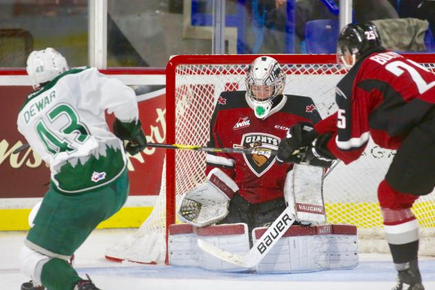 Vancouver Giants goaltender David Tendeck stops a shot by the Everett Silvertips