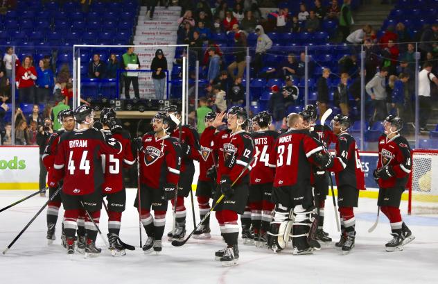Vancouver Giants exchange congratulations following their season-opening win